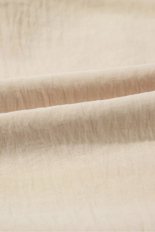Parchment Solid Color Knotted Hem Short Sleeve Blouse