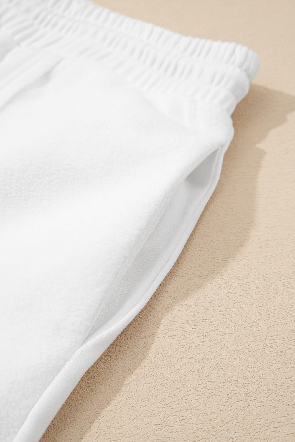 White Textured Raw Seam Plus Size Pullover Top And Drawstring Pants Set