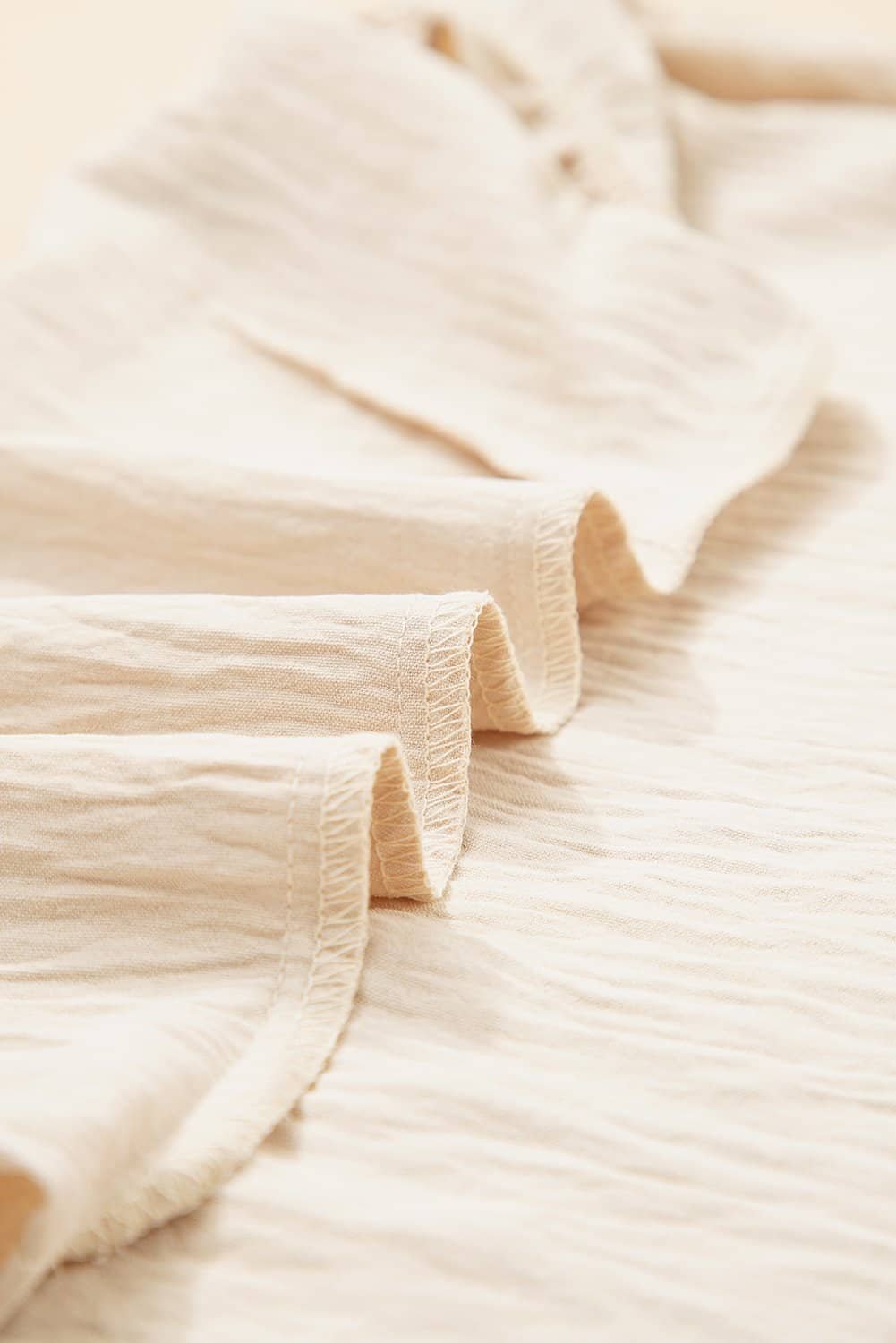 Parchment Textured Frilly Trim V Neck Sleeveless Top