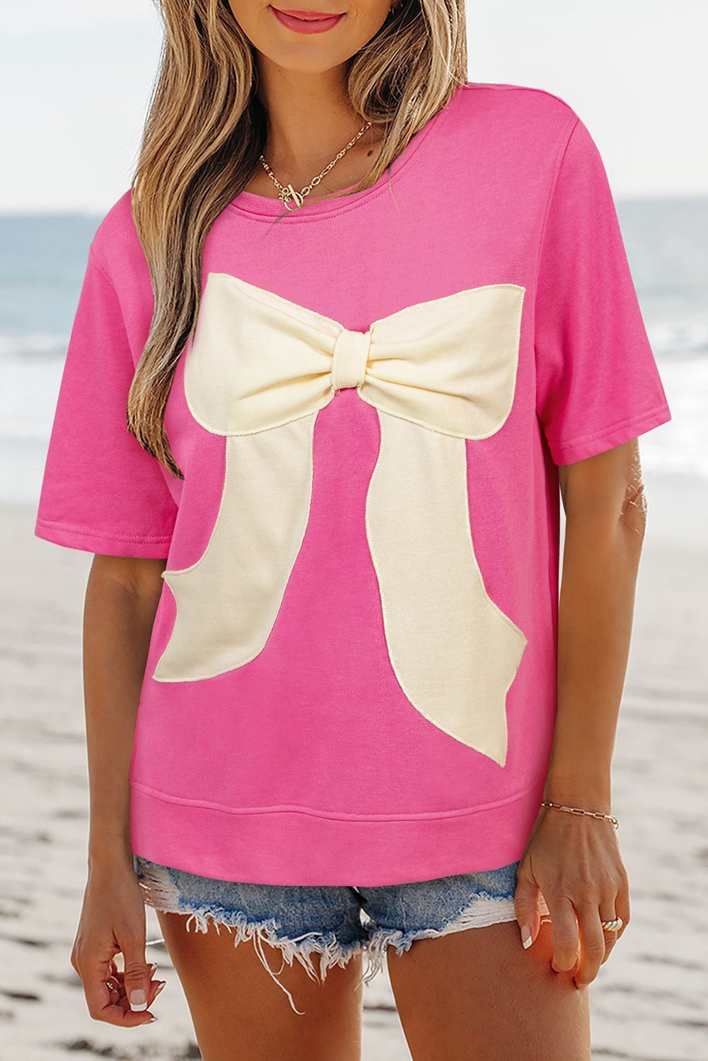 Strawberry Pink Contrasting Color Ribbon Bow Front Patch Loose Tee With Slits