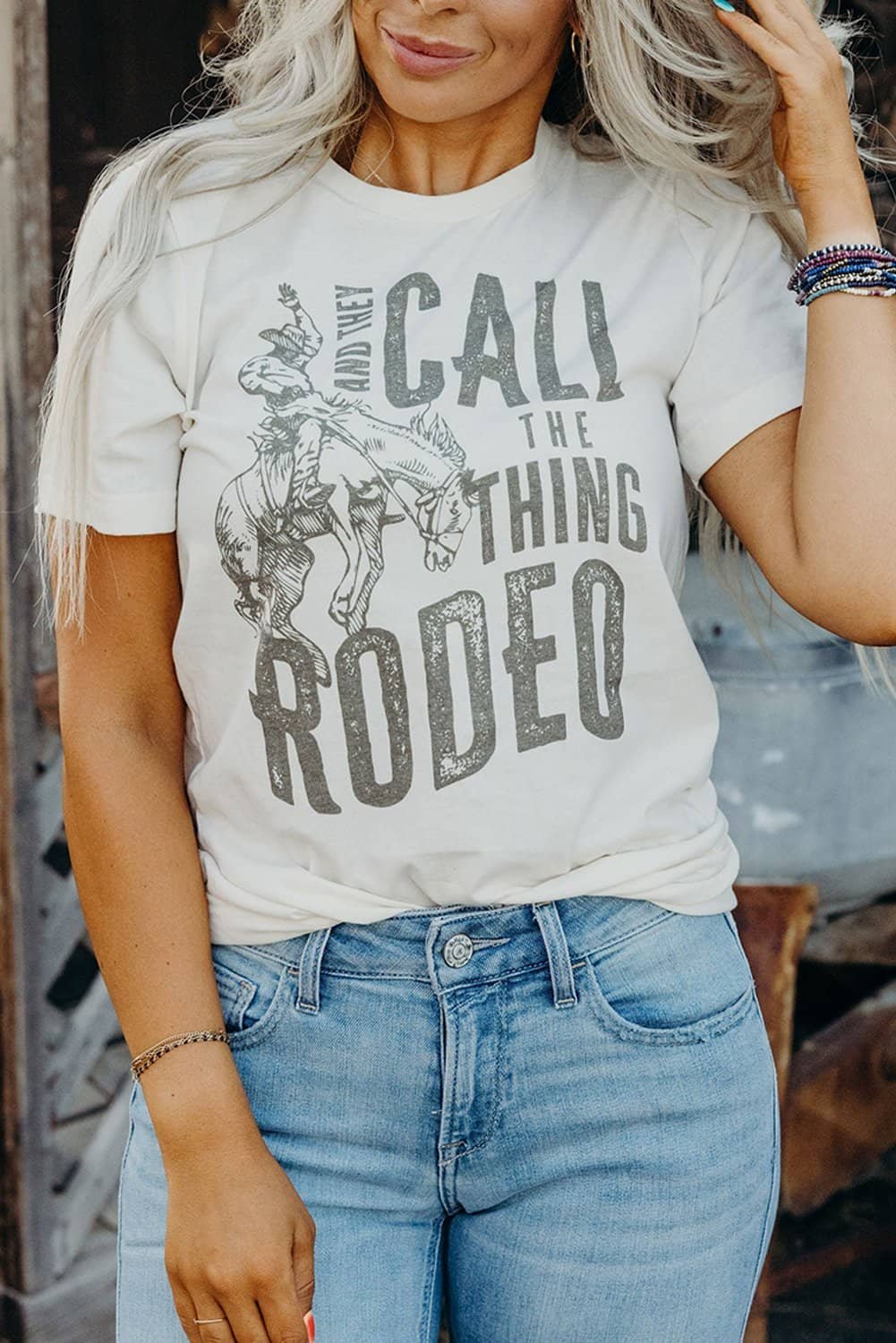 White And They Call The Thing Rodeo Print Round Neck T Shirt