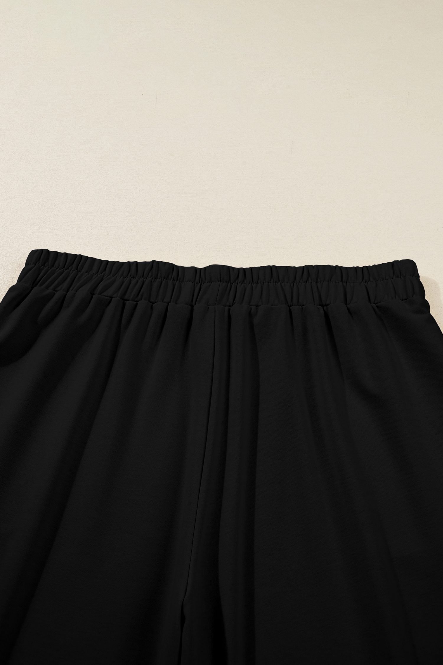Black Plus Size Elastic Waist Asymmetrical Hem Loose Capris Pants