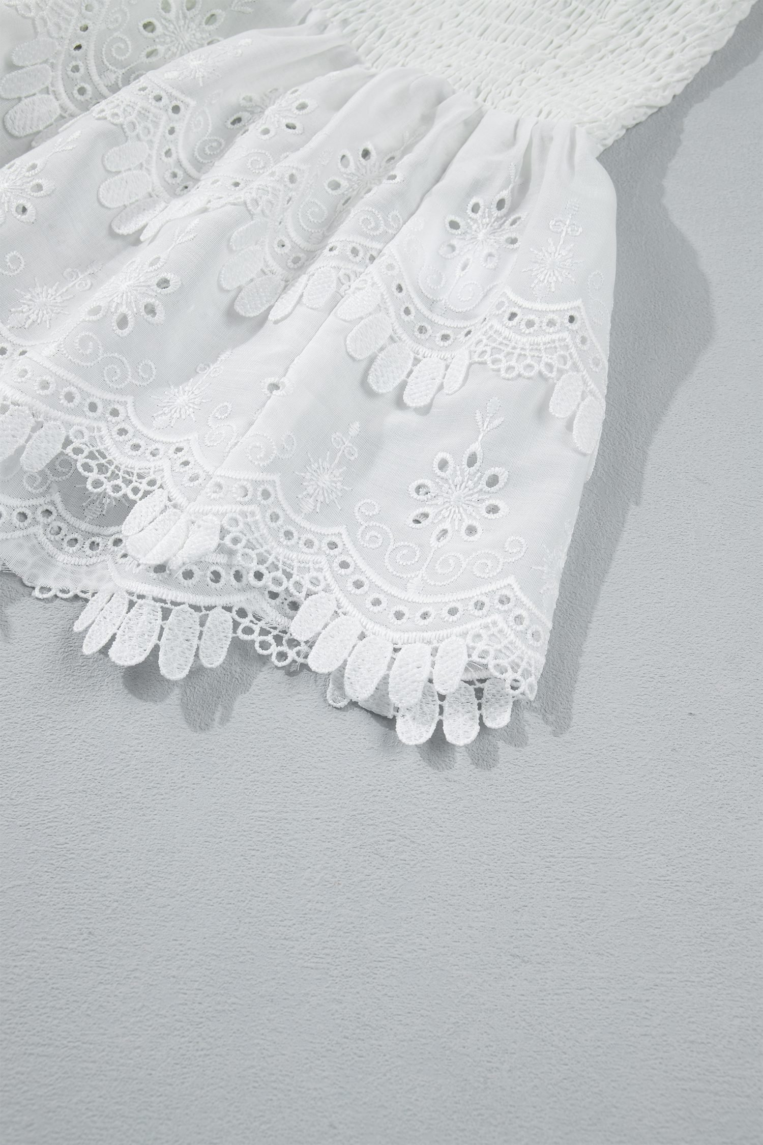 White Sleeveless Smocked Lace Peplum Top